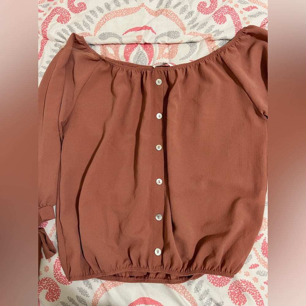 pinkish top with tie sleeve detail, size M